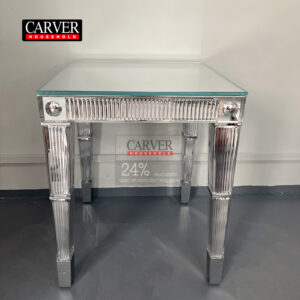 Handcrafted crystal and dining table consoles crafted from glass and stainless steel adorn the crystal table.