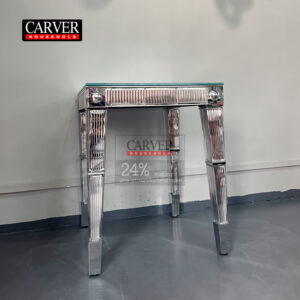 Handcrafted crystal and dining table consoles crafted from glass and stainless steel adorn the crystal table.