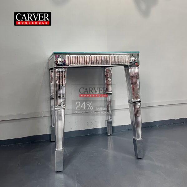 Handcrafted crystal and dining table consoles crafted from glass and stainless steel adorn the crystal table.